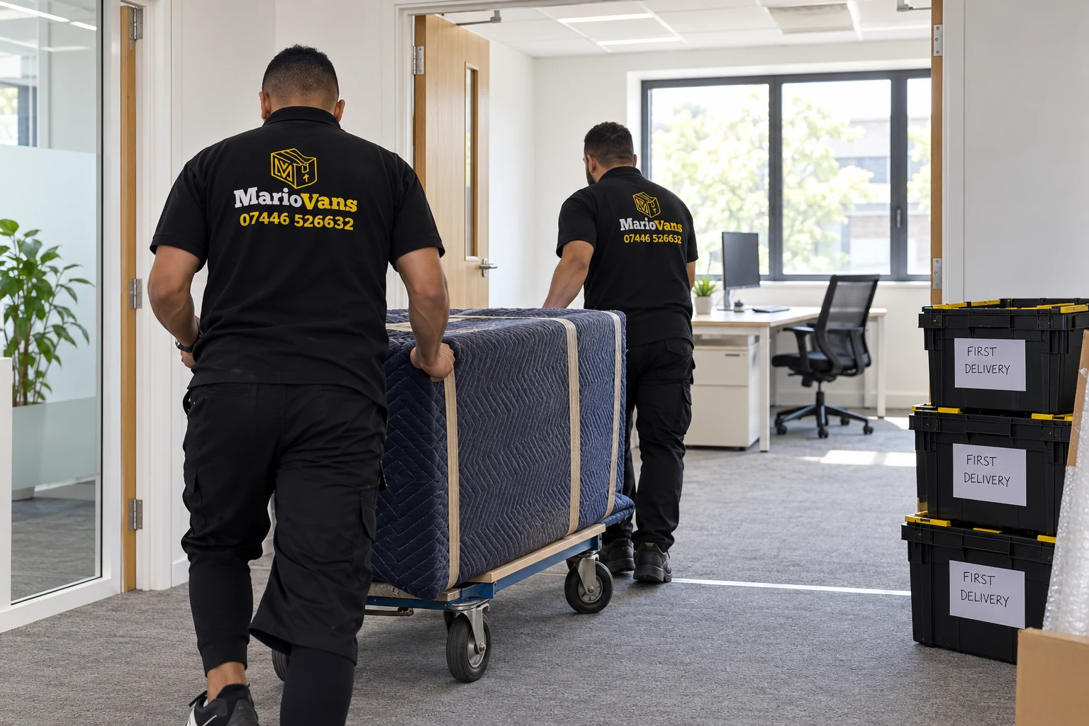 MarioVans movers returning protected furniture and first-delivery crates to a new office